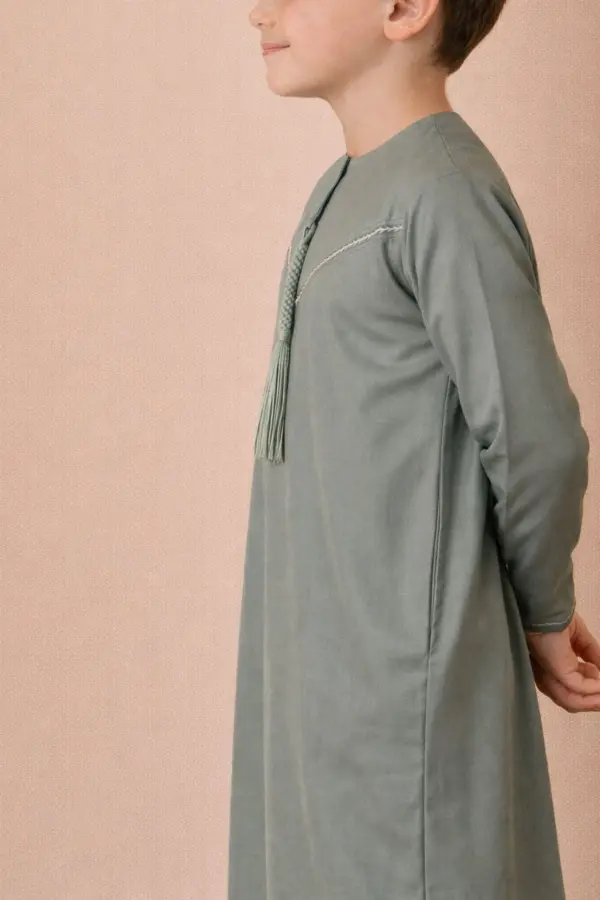 Premium Sage Green Emirati Kids Thobe with Contrast V-Stitch & Tassel - Image 4 - Ruby Online