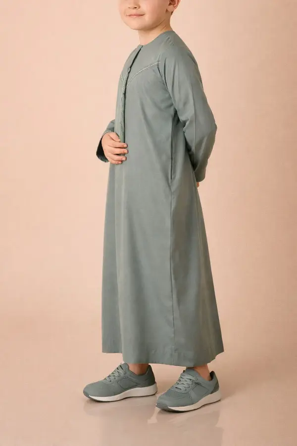 Premium Sage Green Emirati Kids Thobe with Contrast V-Stitch & Tassel - Image 3 - Ruby Online