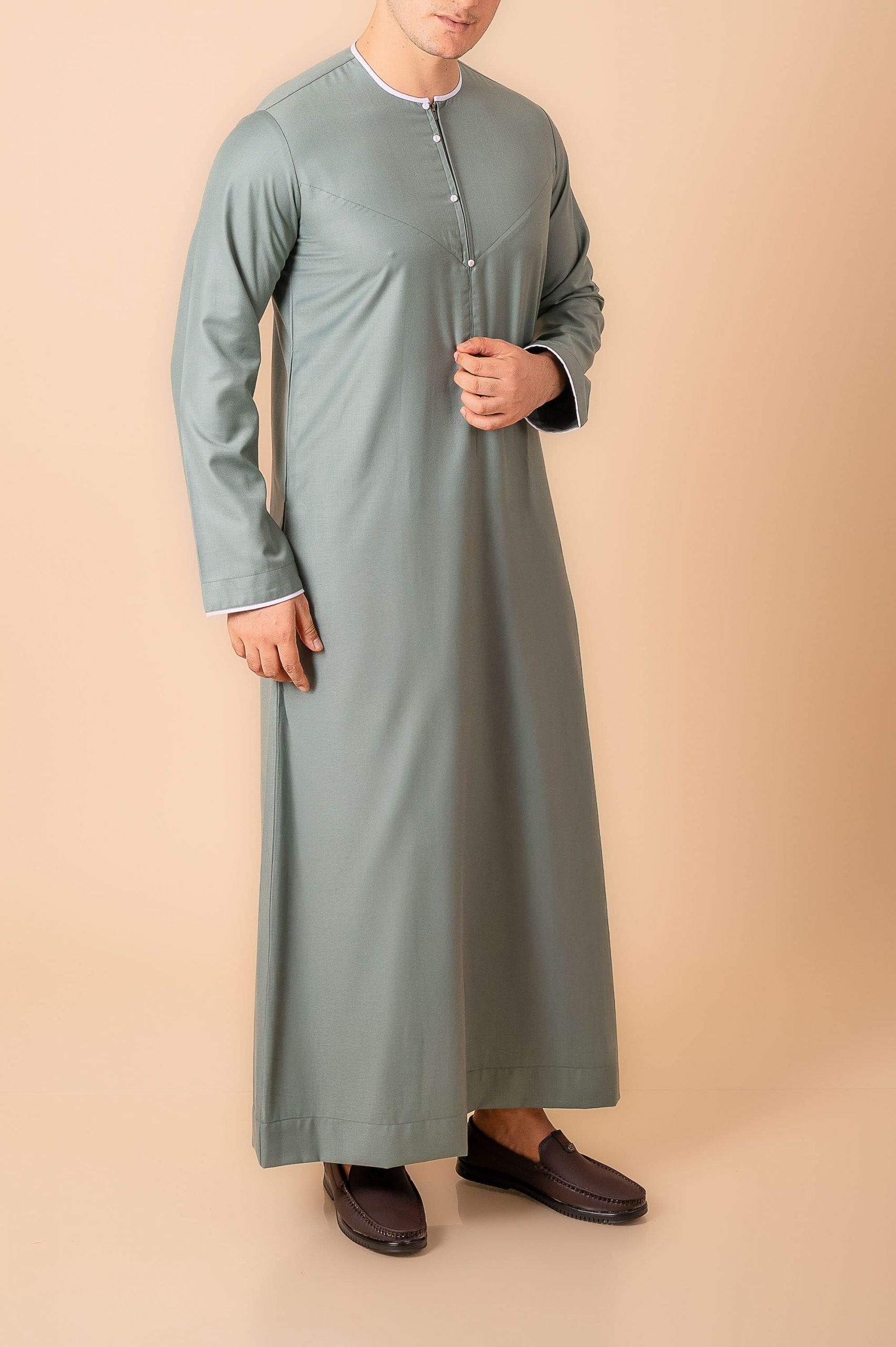 Premium Sage Green Emirati Thobe for Men with White Contrast Piping & Modern Panel Cut - Image 8 - Ruby Online