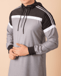 Men wearing light grey hooded thobe with black upper panel, white stripe design and zip front neckline