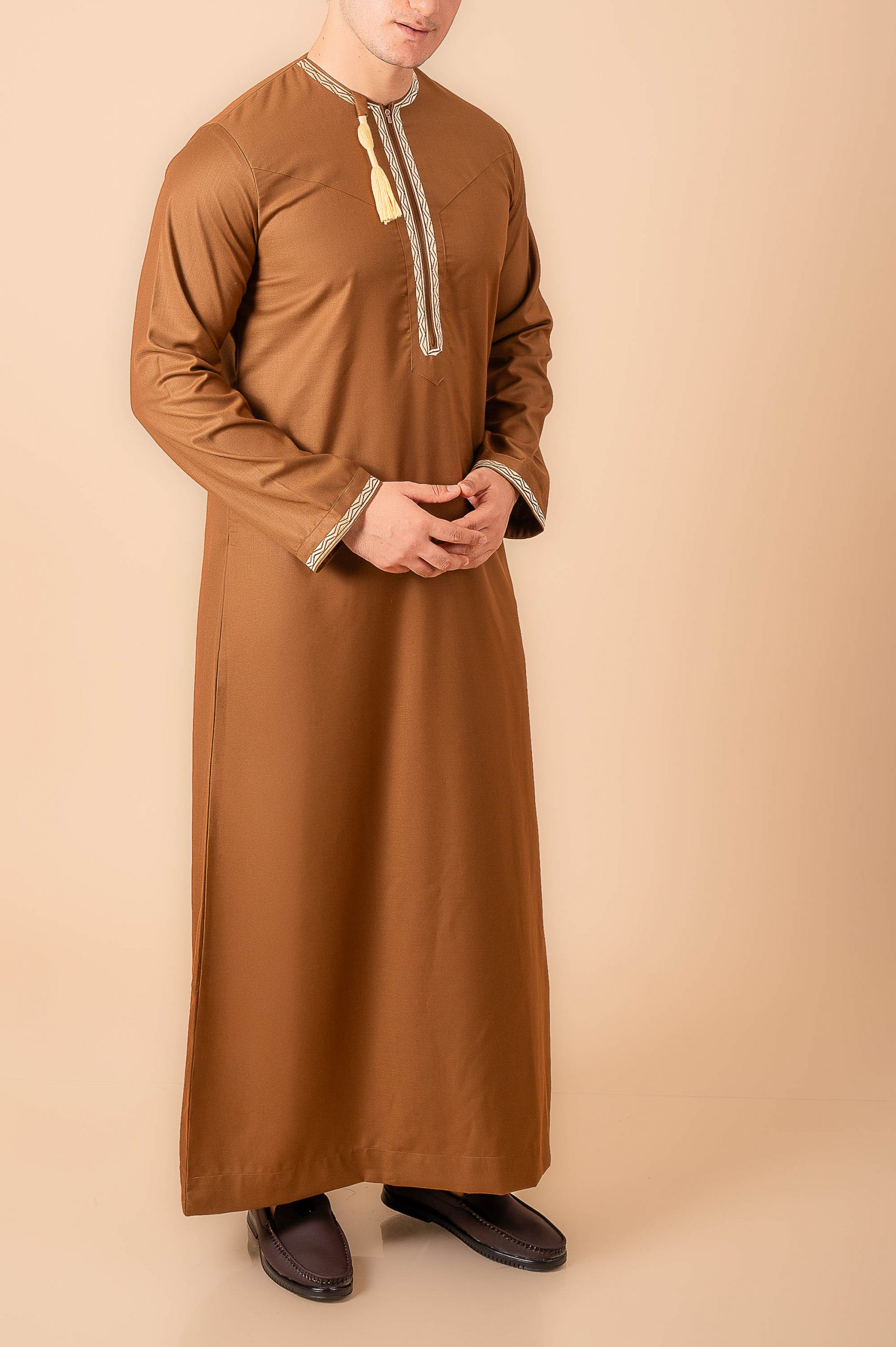 Coffee brown Omani thobe with beige geometric embroidery and tassel for men