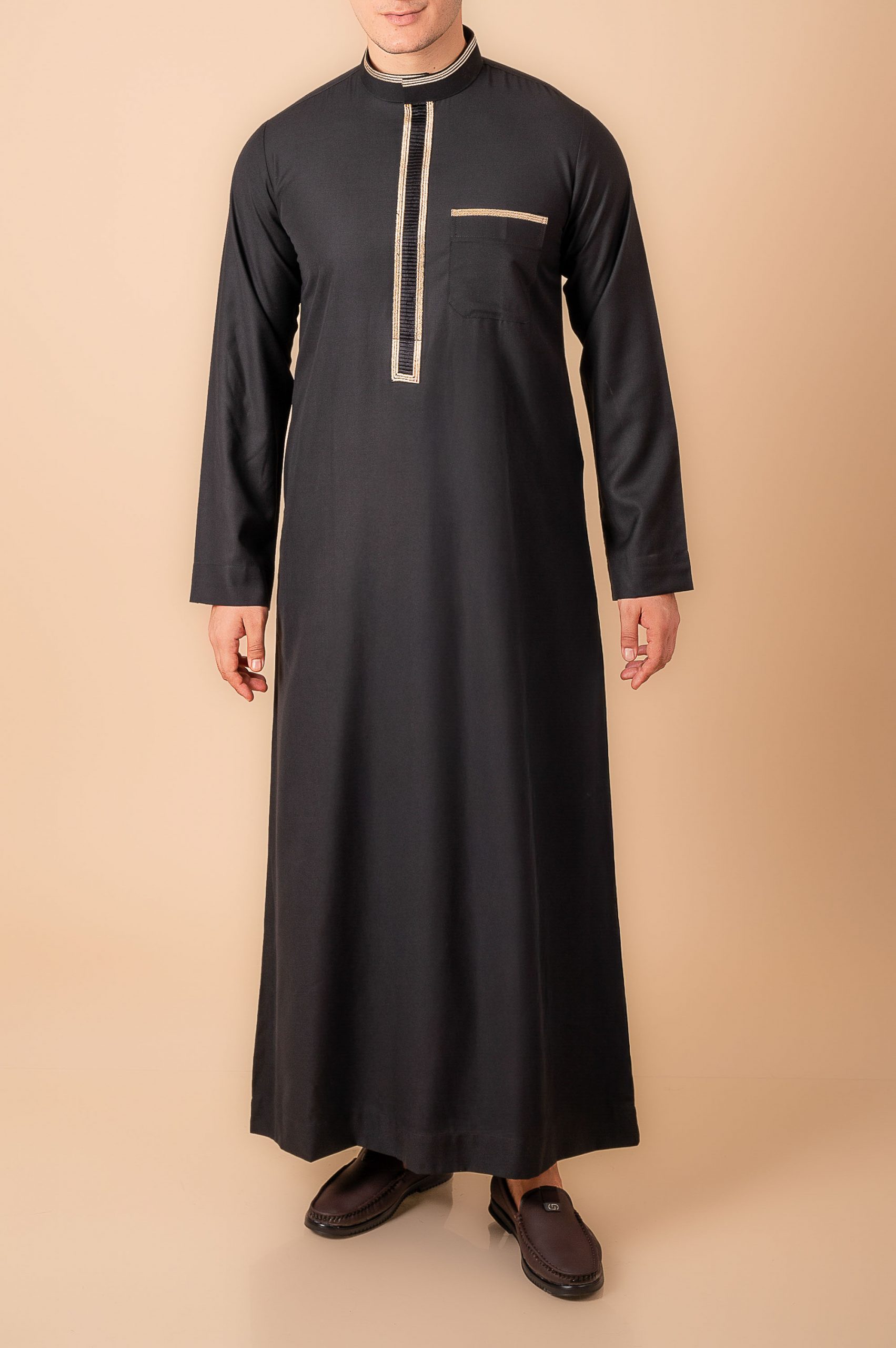 Jet black men’s thobe with gold geometric embroidered placket and band collar trim