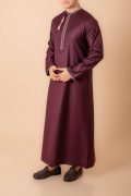 Maroon Omani thobe with white geometric embroidery and tassel for men
