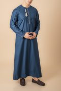 Teal blue Omani thobe with white geometric embroidery and tassel for men