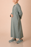 Kids sage green Emirati thobe with V panel contrast stitch and tassel