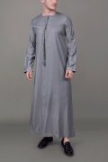 Grey Emirati tassel thobe with silver chest embroidery and decorative sleeve detailing