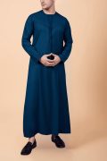 men teal blue emirati tassel thobe with chevron stitched chest panel and front tassel kandura