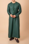 deep emerald green emirati tassel thobe for men with light sage braided chest panel and front tassel kandura