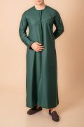 deep emerald green emirati tassel thobe for men with light sage braided chest panel and front tassel kandura