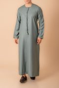 sage green emirati tassel thobe for men with silver braided v panel and front tassel kandura