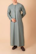 sage green emirati tassel thobe for men with silver braided v panel and front tassel kandura