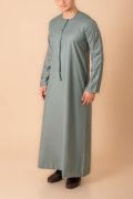 sage green emirati tassel thobe for men with silver braided v panel and front tassel kandura