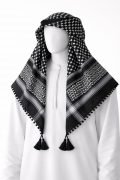 Black traditional Arab shemagh keffiyeh scarf with white woven pattern and tassel edges.