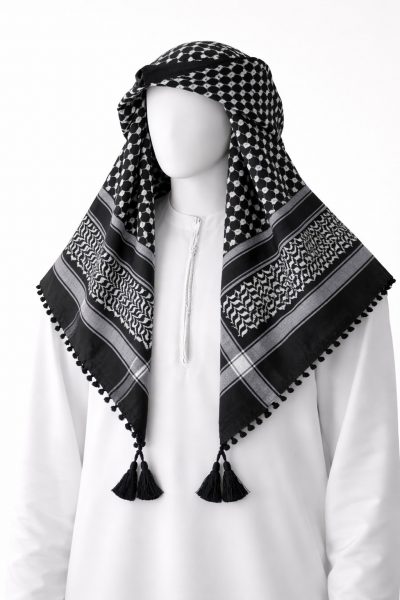 Black traditional Arab shemagh keffiyeh scarf with white woven pattern and tassel edges.