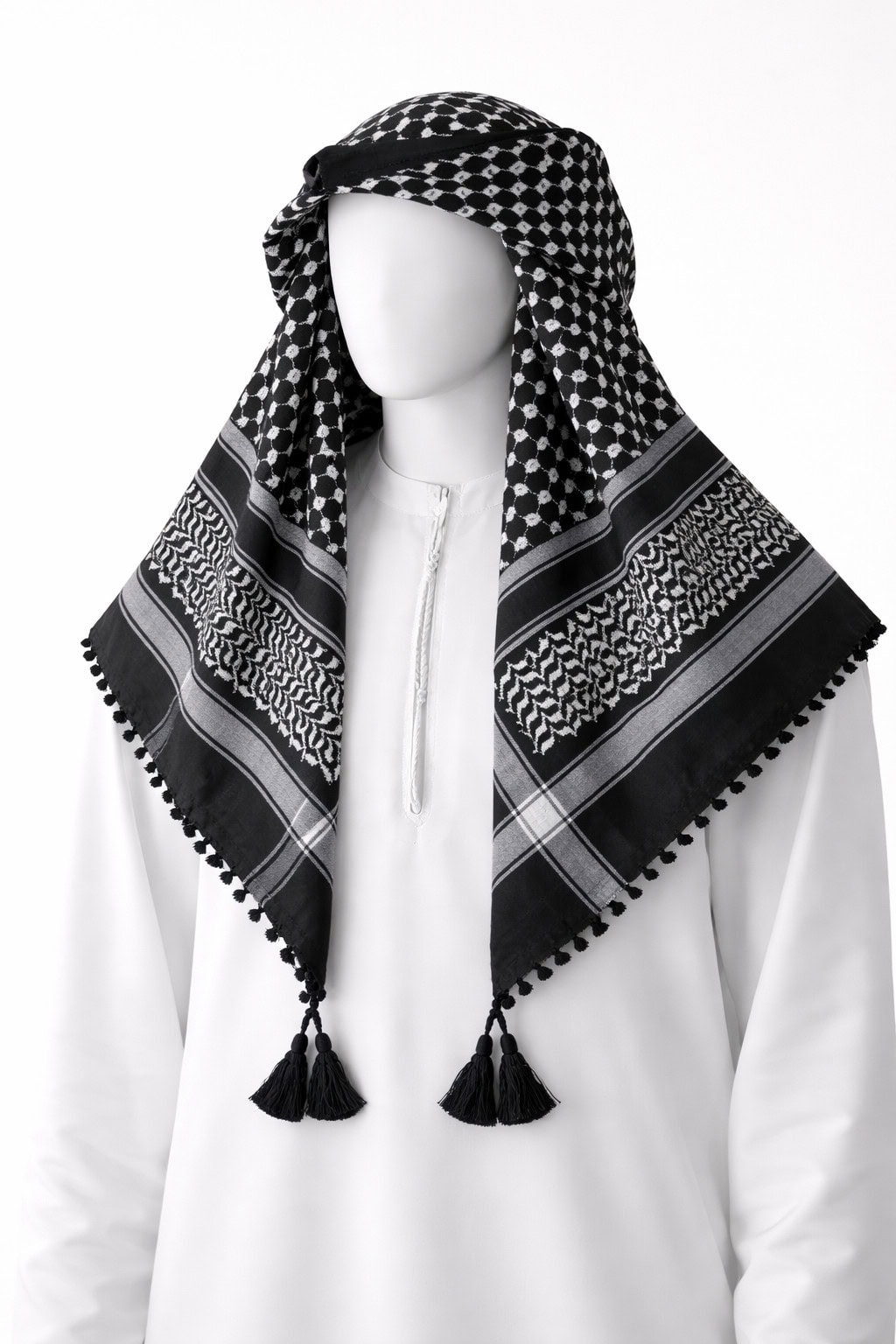 v Black traditional Arab shemagh keffiyeh scarf with white woven pattern and tassel edges.