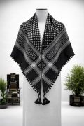 Black traditional Arab shemagh keffiyeh scarf with white woven pattern and tassel edges.