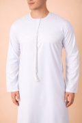 Pure white Emirati tassel thobe with tonal embroidered chest and sleeve detailing