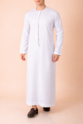 Pure white Emirati tassel thobe with tonal embroidered chest and sleeve detailing