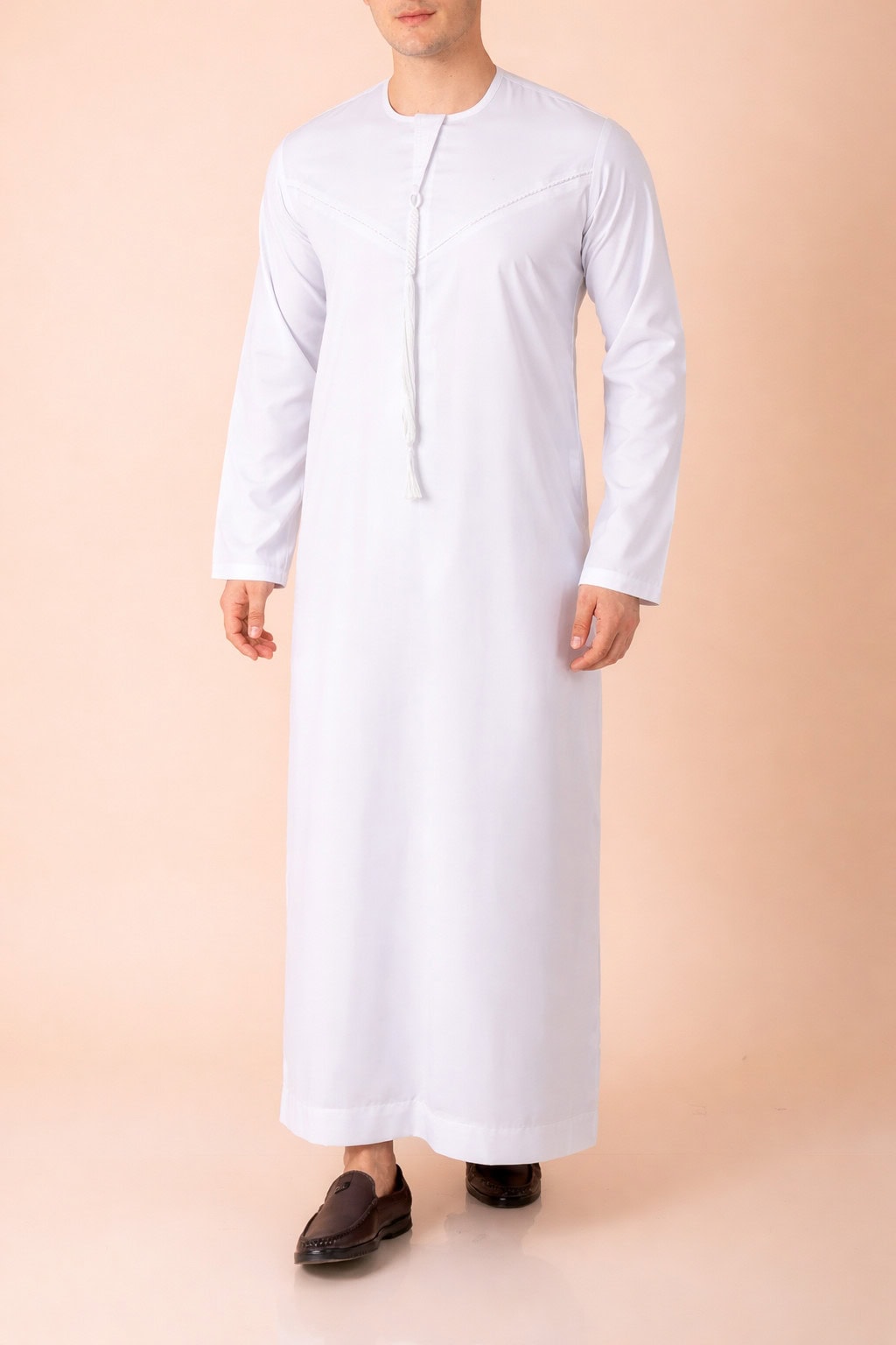 Pure white Emirati tassel thobe with tonal embroidered chest and sleeve detailing