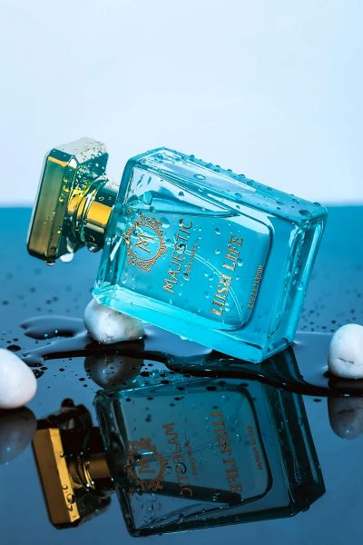 Majestic Lush Life aqua blue perfume bottle with gold cap fresh citrus fragrance