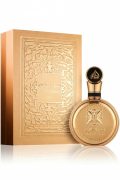 Luxury Lattafa Fakhar Gold 100ml perfume bottle and box featuring traditional Arabic calligraphy and gold filigree medallion design.
