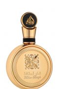 Luxury Lattafa Fakhar Gold 100ml perfume bottle and box featuring traditional Arabic calligraphy and gold filigree medallion design.